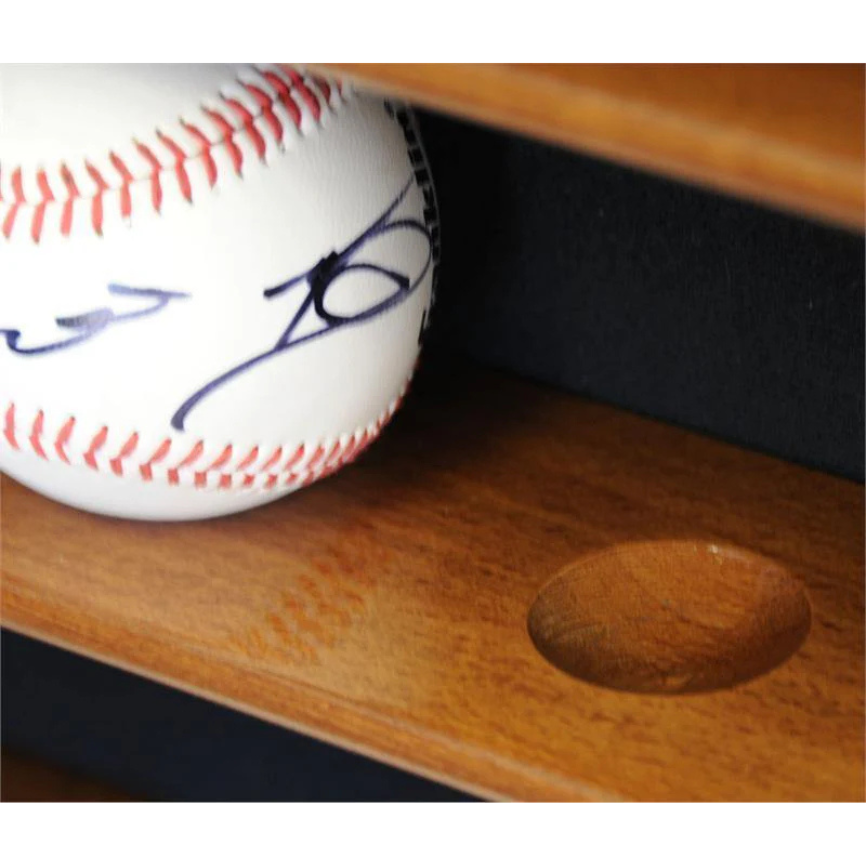 Baseball with autograph on a wooden shelf. Baseball Display Case Holder.