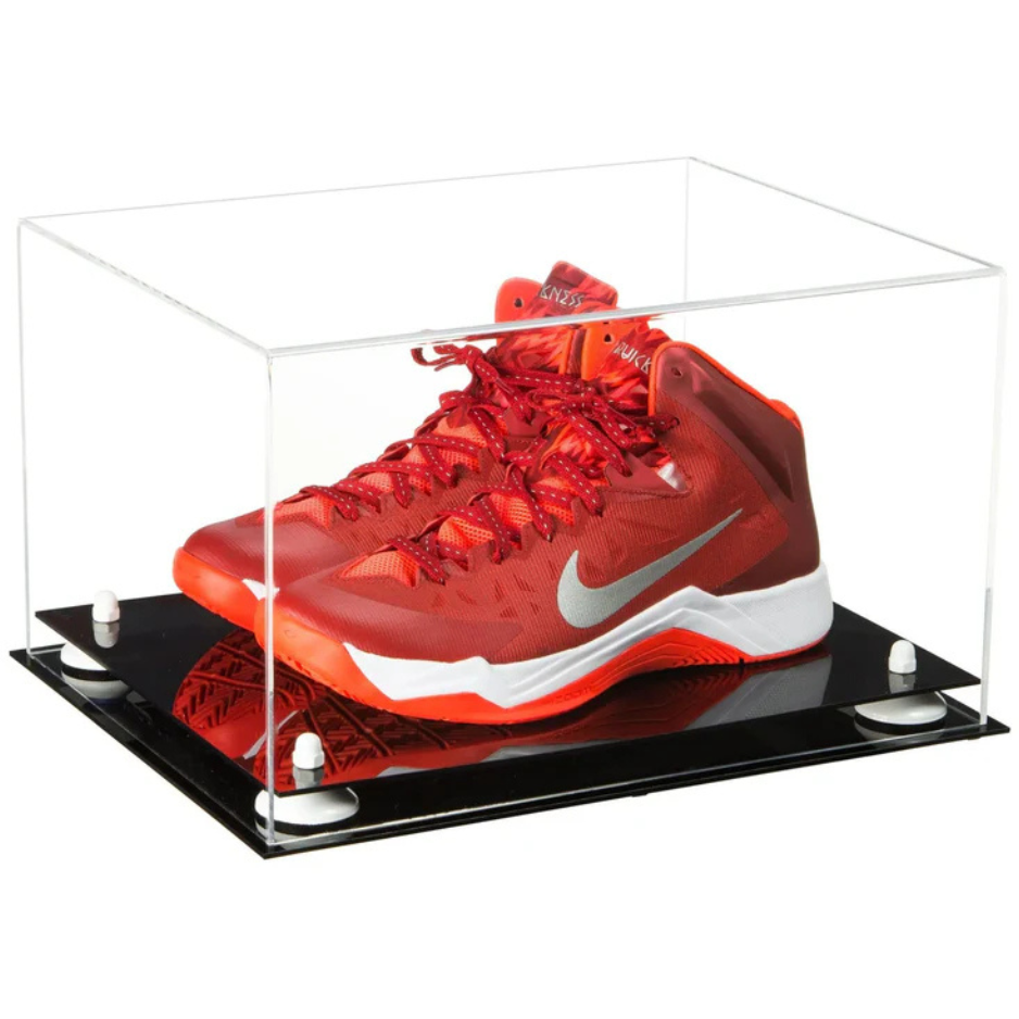 Red Nike basketball shoe in a clear display case on a white background