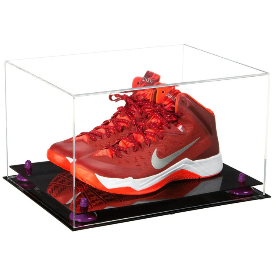 Red and orange sneaker in a clear display case on a black platform