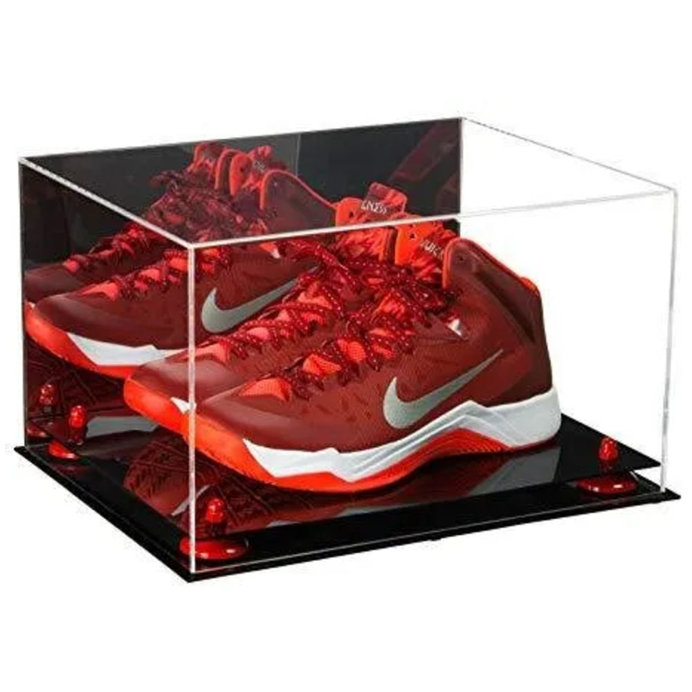 Red Nike sneakers in a clear display case on a white background