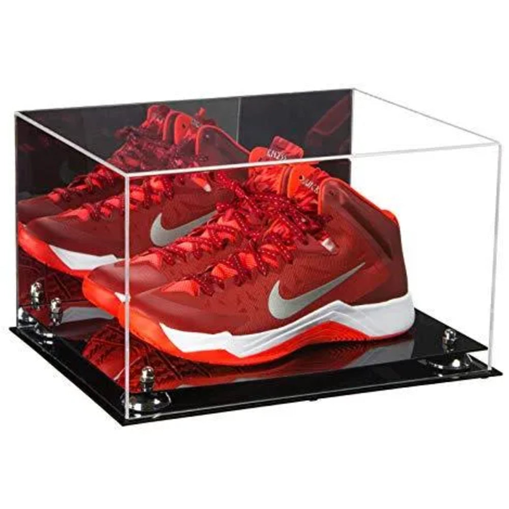 Red sneakers with white swoosh logo in a clear display case on a black base.
