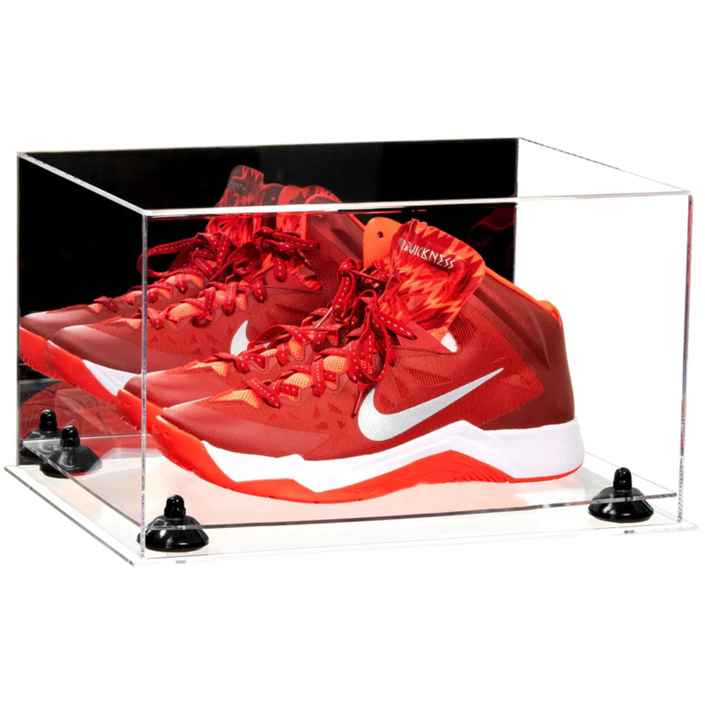 Red Nike sneakers in a clear display case on a white background