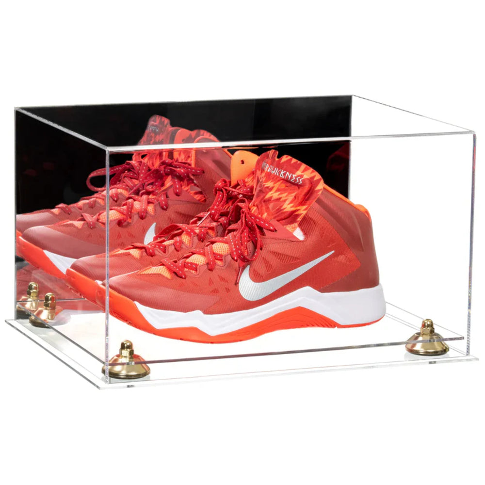Red Nike sneakers in a clear display case on a white background