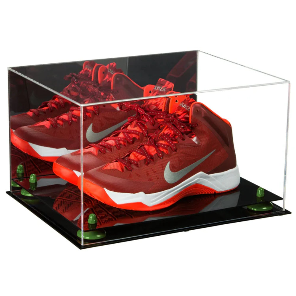 Red sneakers with white swoosh logo in a clear display case on a black base