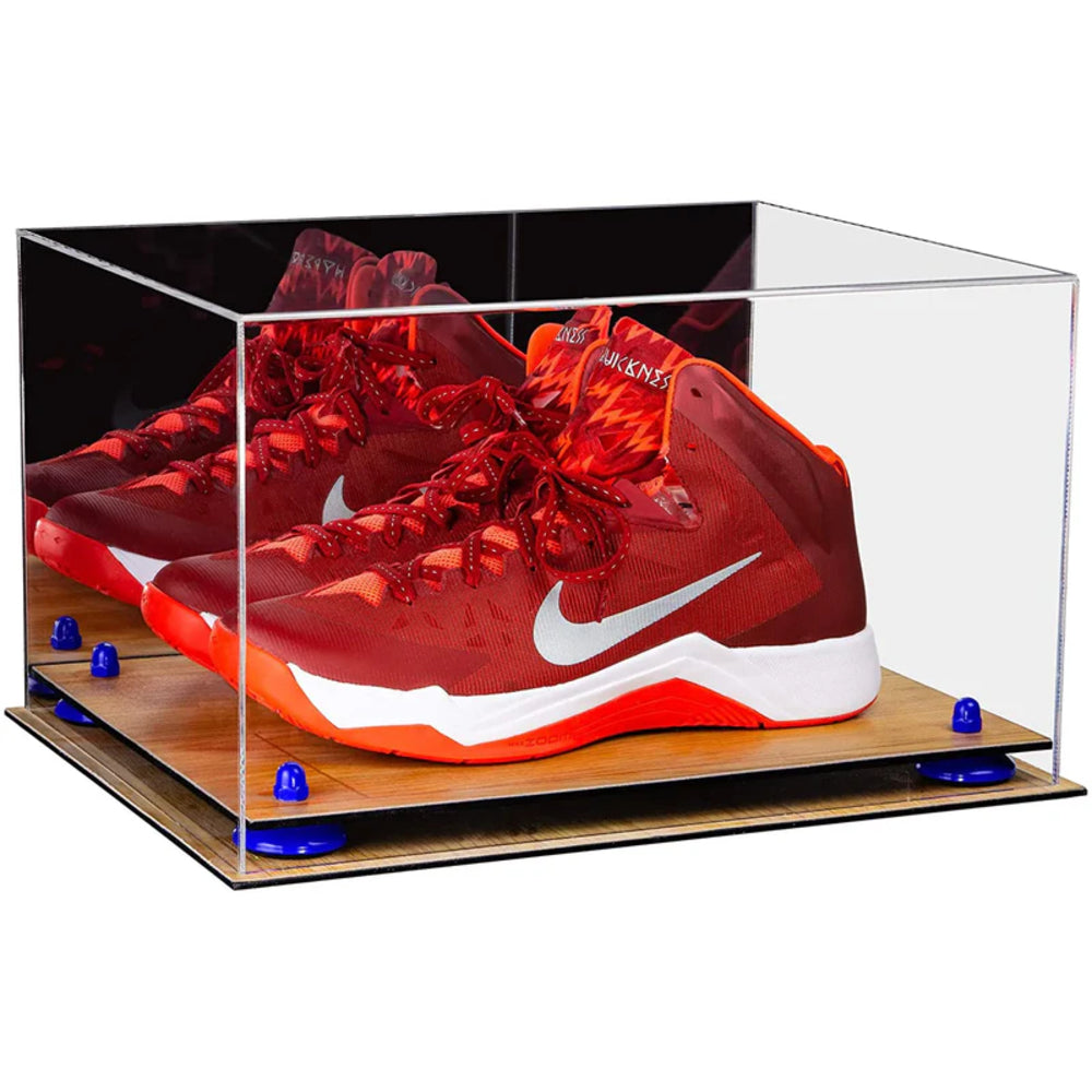 Red and orange sneaker with white swoosh logo in a clear display case on a white background