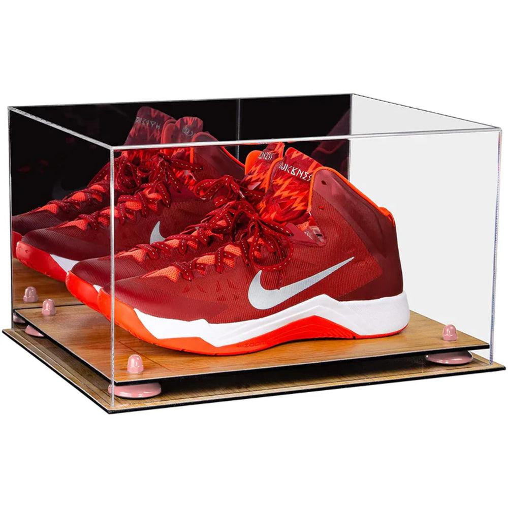 Red and orange Nike basketball shoes in a clear display case on a white background