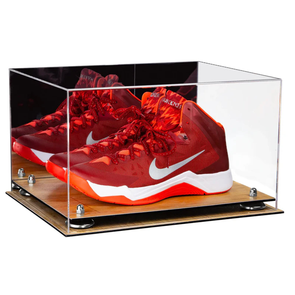 Red and white sneakers in a clear display case on a wooden base