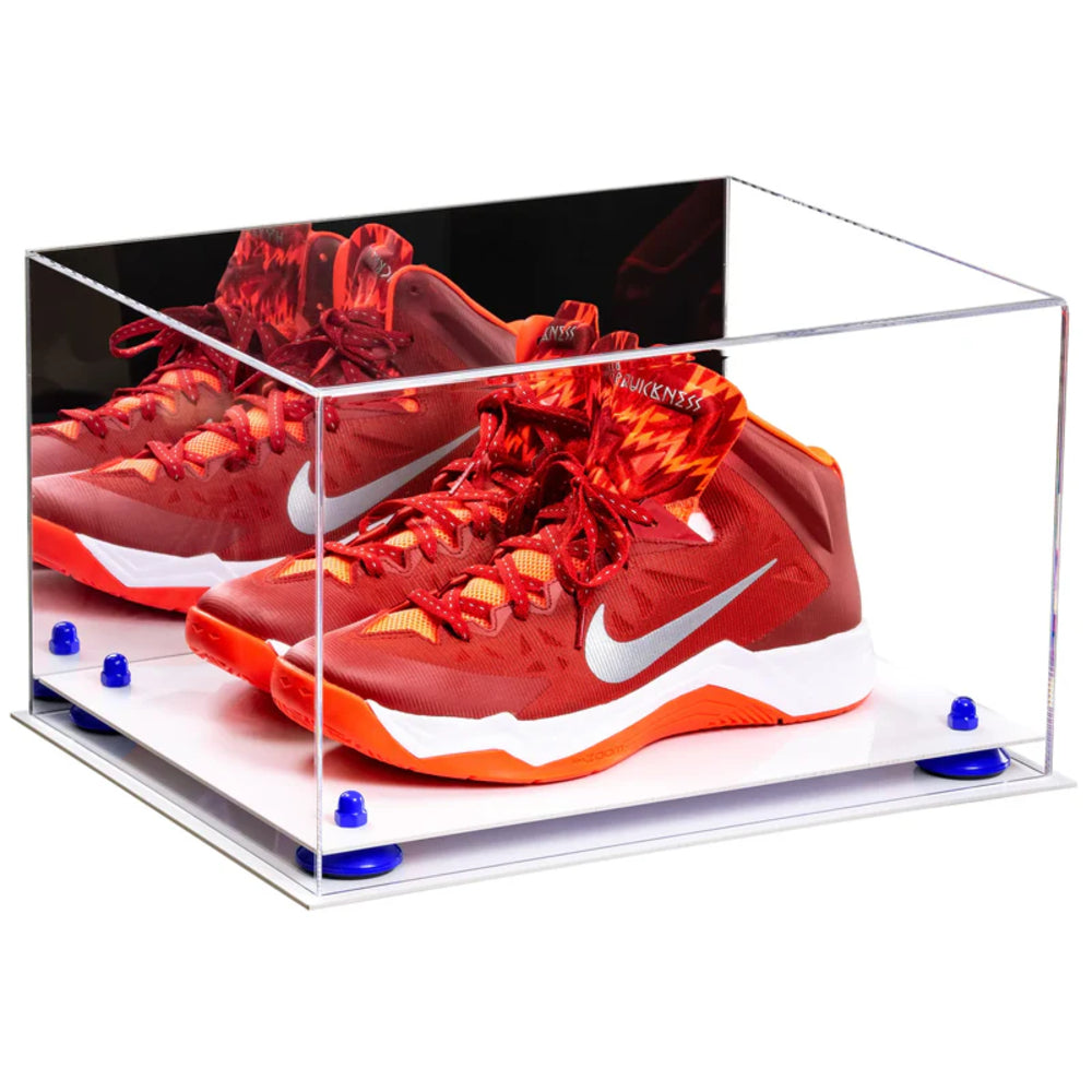 Red Nike sneakers in a clear display case on a white background