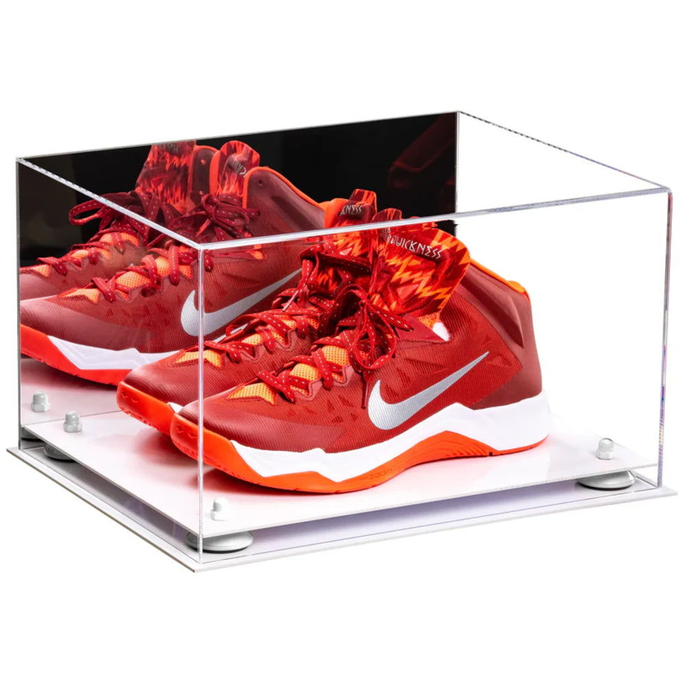 Red Nike basketball shoes in a clear display case on a white background