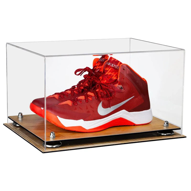 Red basketball shoe with white swoosh logo in a clear display case on a wooden base.