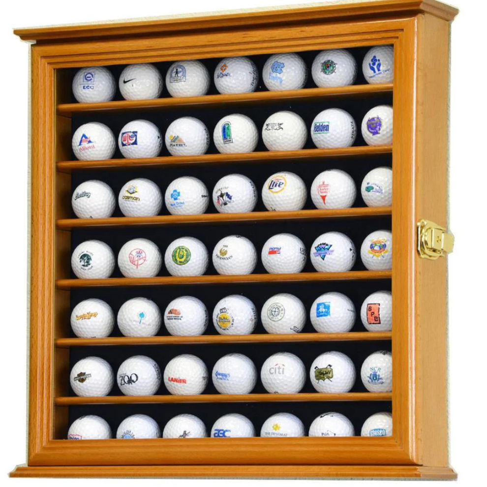 Wooden golf ball display cabinet with various branded golf balls inside. Golf ball display case cabinet holder