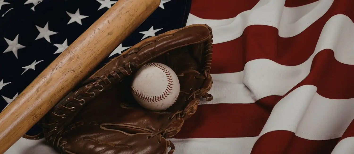 Baseball bat, glove, and baseball on American flag representing baseball bat display cases