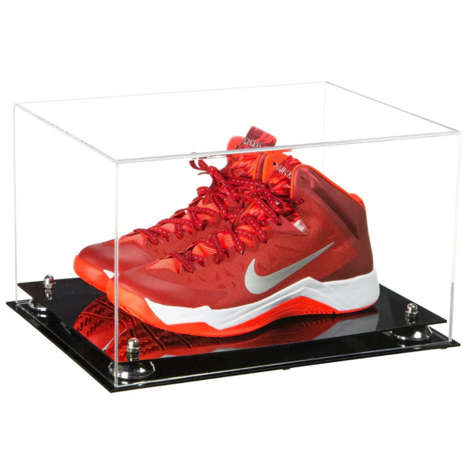 Red Nike basketball shoe in a clear display case on a white background