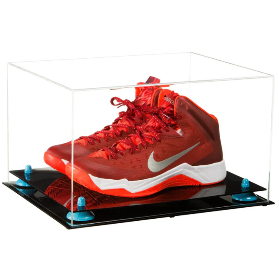 Red sneaker in a clear display case on a white background