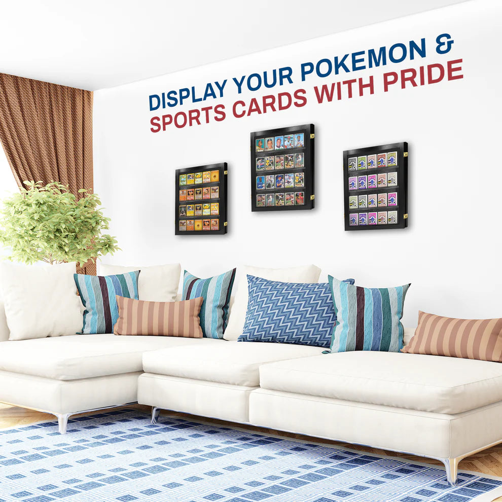 Living room with a white sofa and decorative pillows, featuring wall-mounted display cases for Pokemon and sports cards.