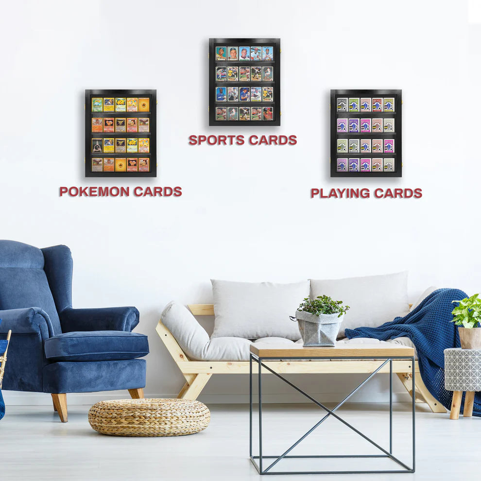 Framed collectible card displays on a wall above a living room setup with furniture and decor.