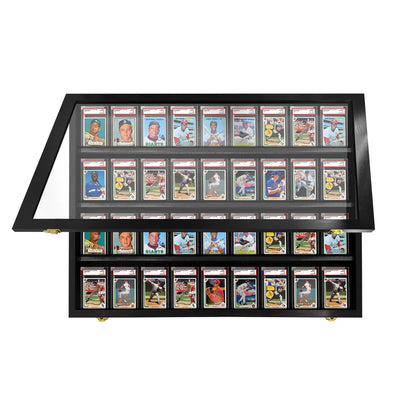 Collection of sports trading cards in a display case on a white background