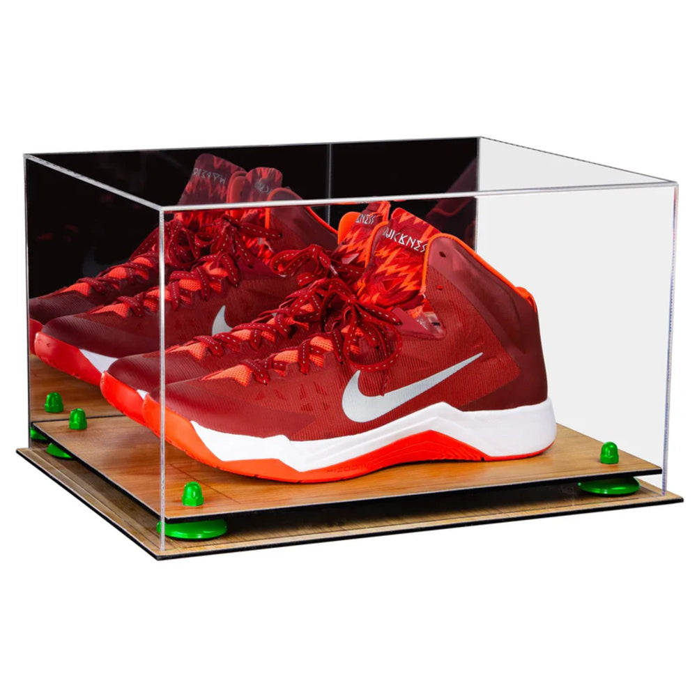 Red sneakers with a white logo in a clear display case on a white background