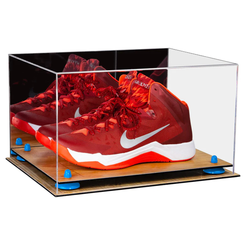 Red Nike basketball shoes in a clear display case on a white background
