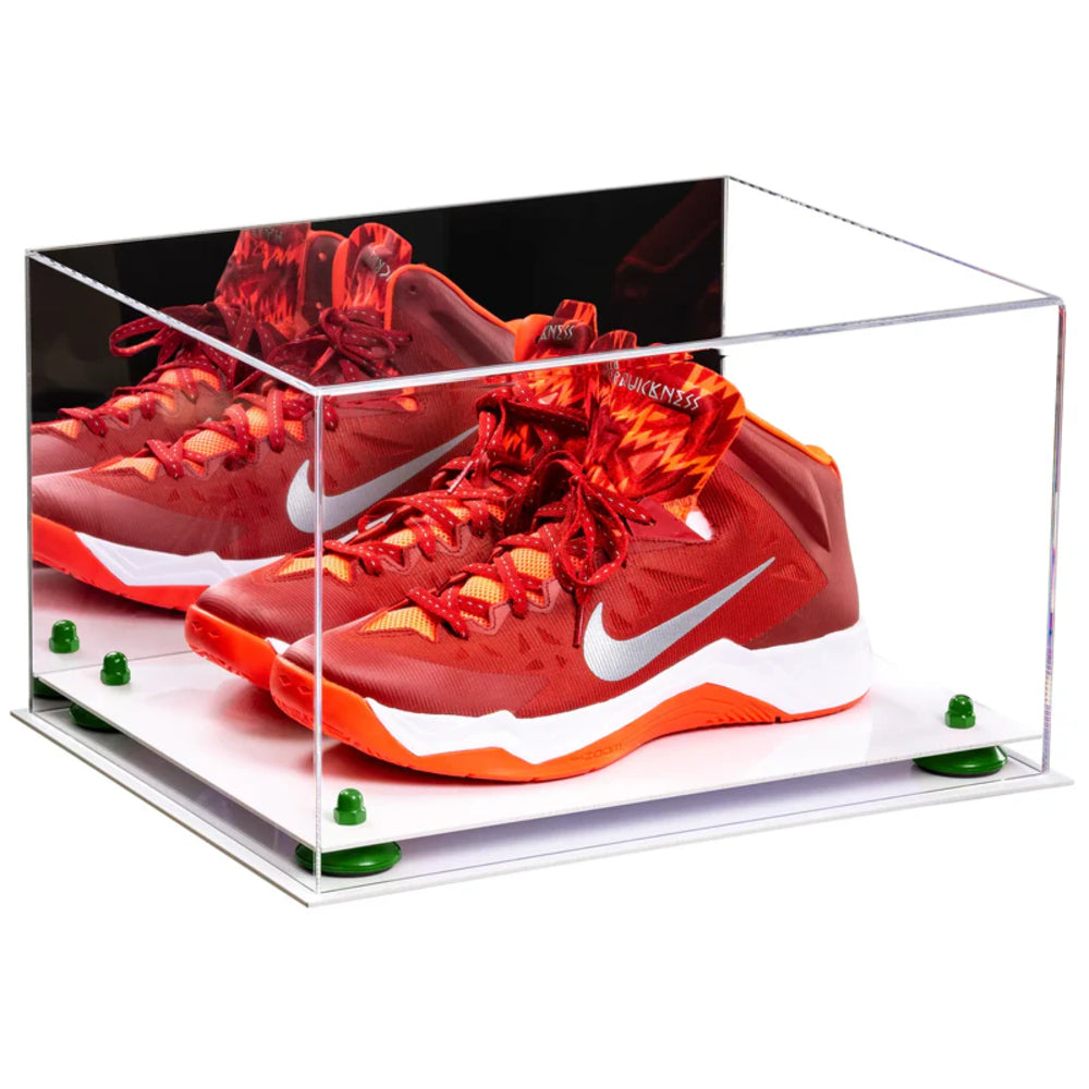Red and orange Nike sneakers in a clear display case on a white background