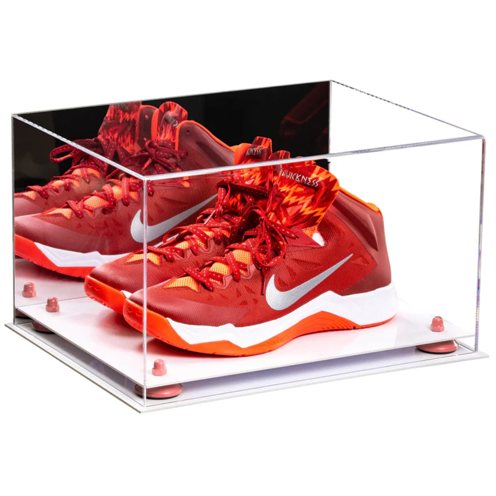 Red Nike sneakers in a clear display case on a white background