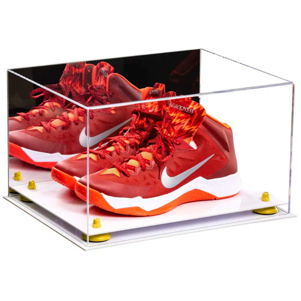 Red Nike sneakers in a clear display case on a white background