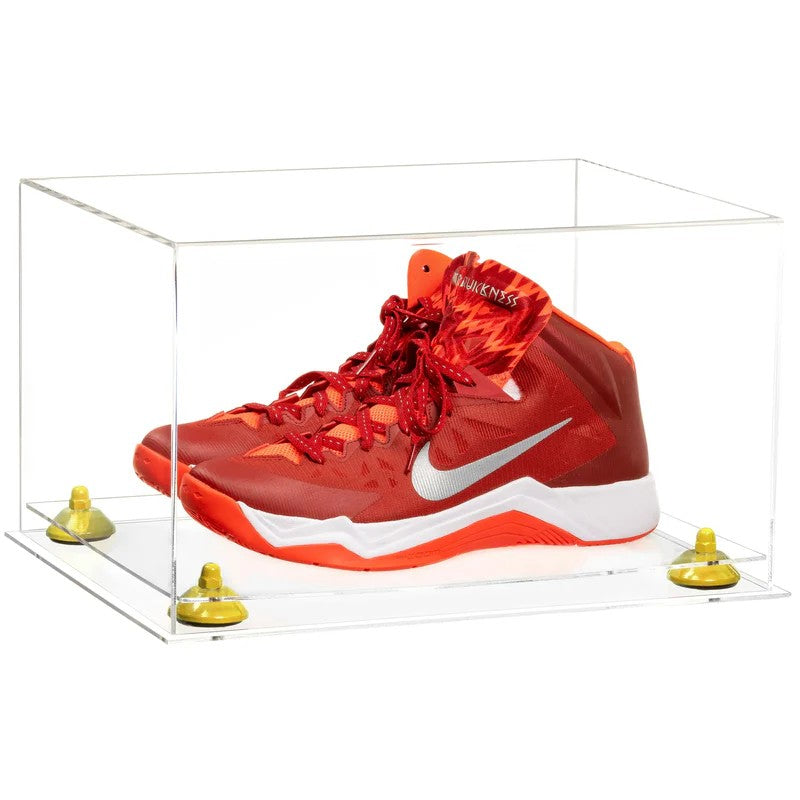 Red Nike basketball shoes in a clear display case on a white background