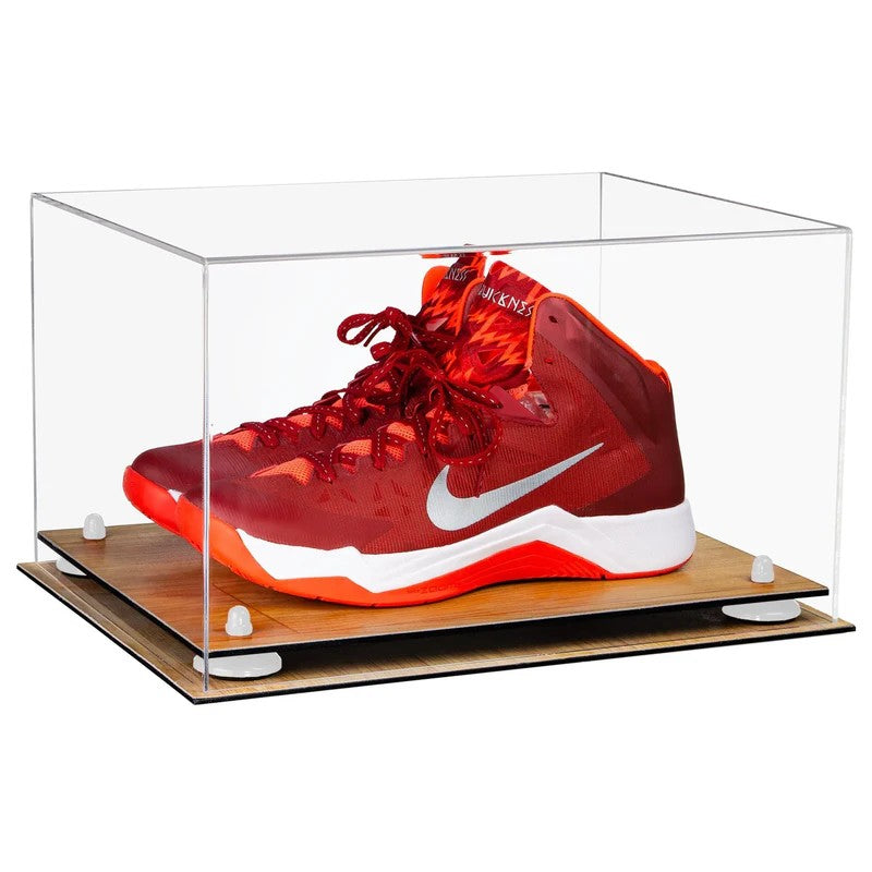Red Nike basketball shoe in a clear display case on a white background