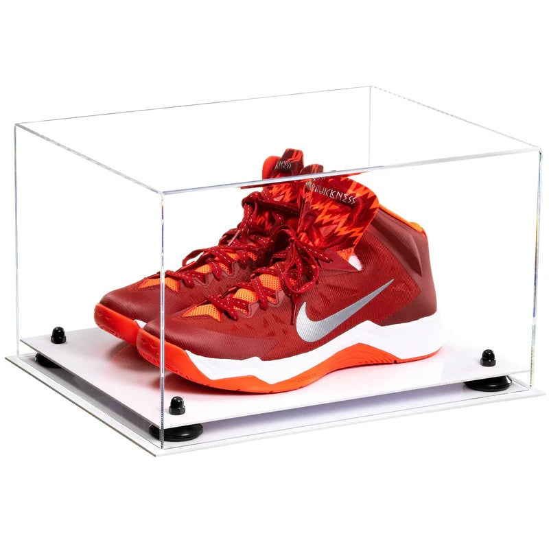 Red and orange sneaker in a clear display case on a white background