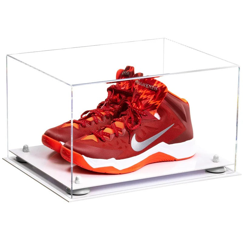 Red and orange sneaker in a clear display case on a white background