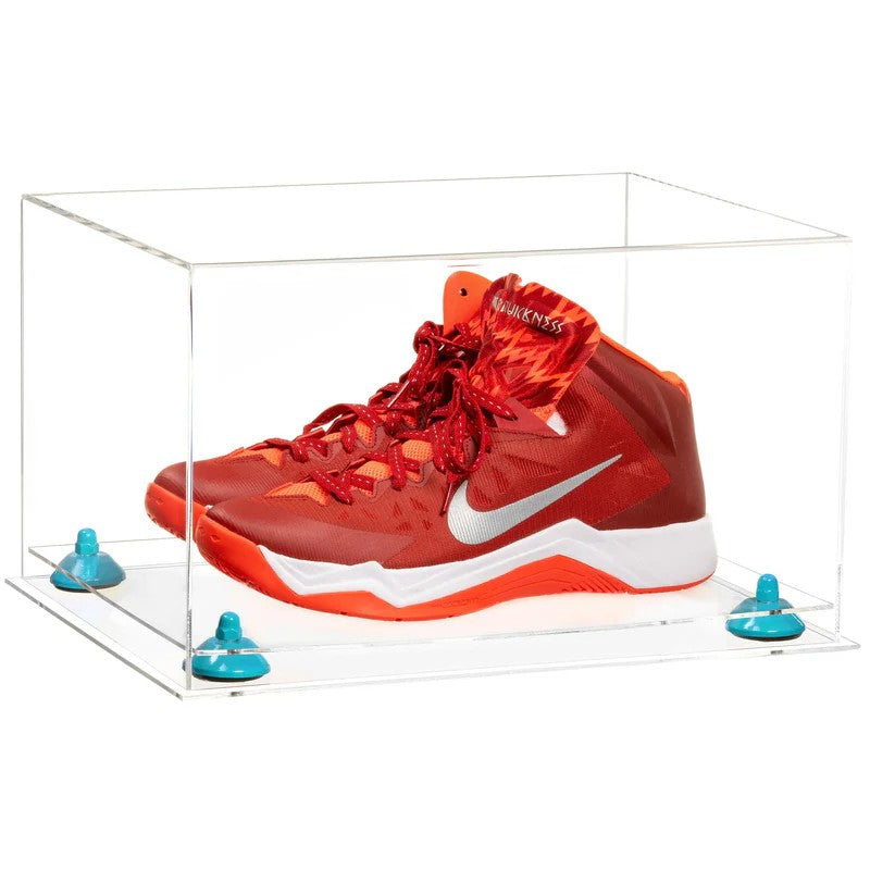 Red Nike basketball shoes in a clear display case on a white background