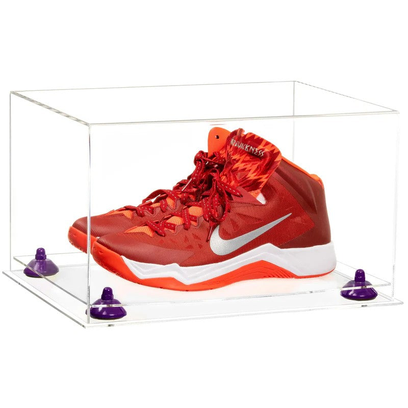 Red Nike basketball shoes in a clear display case on a white background