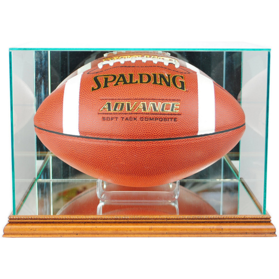 Full-size football displayed horizontally in a real-glass case with a hardwood base and mirrored panels