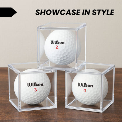 Single golf ball in a clear acrylic cube display case