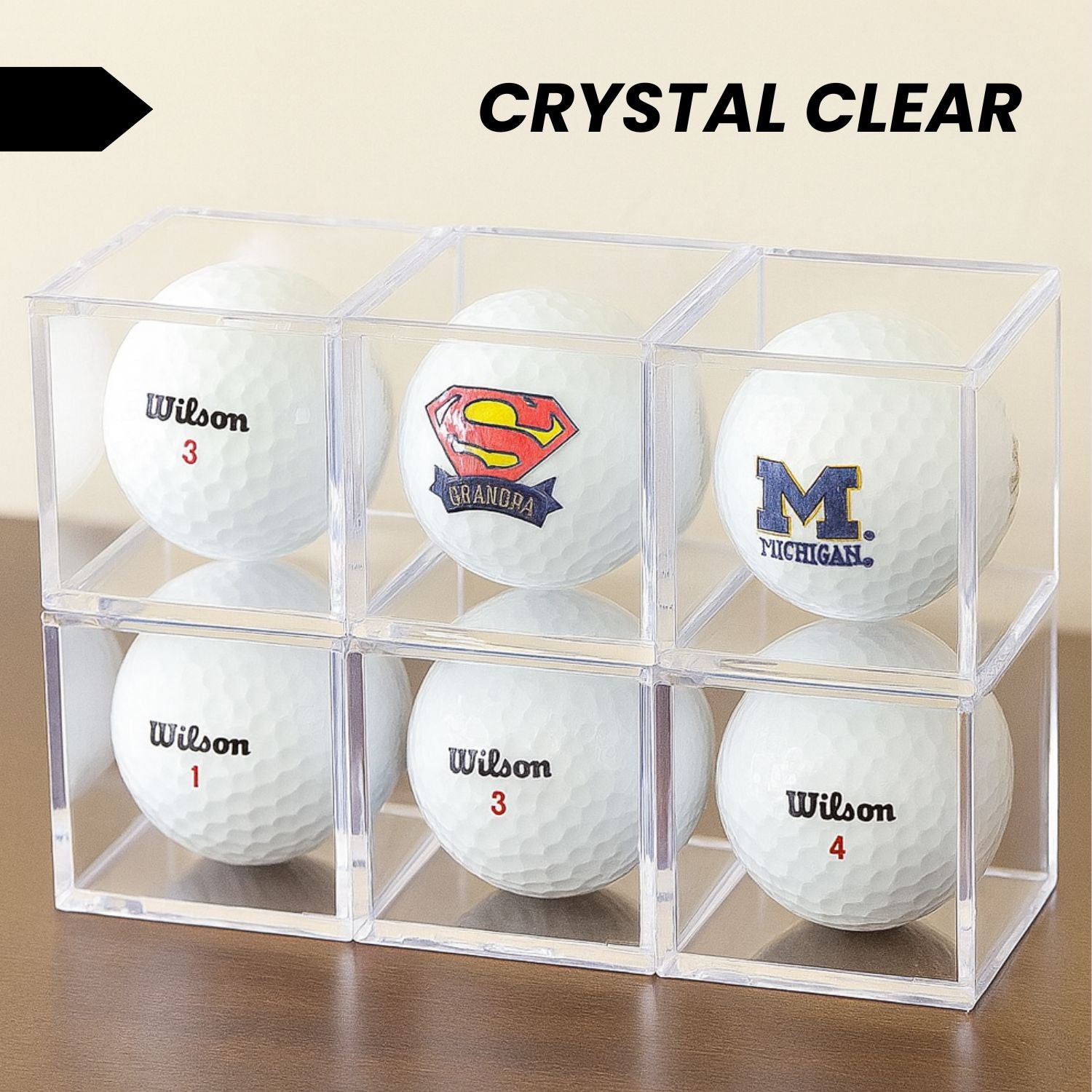 Single golf ball in a clear acrylic cube display case