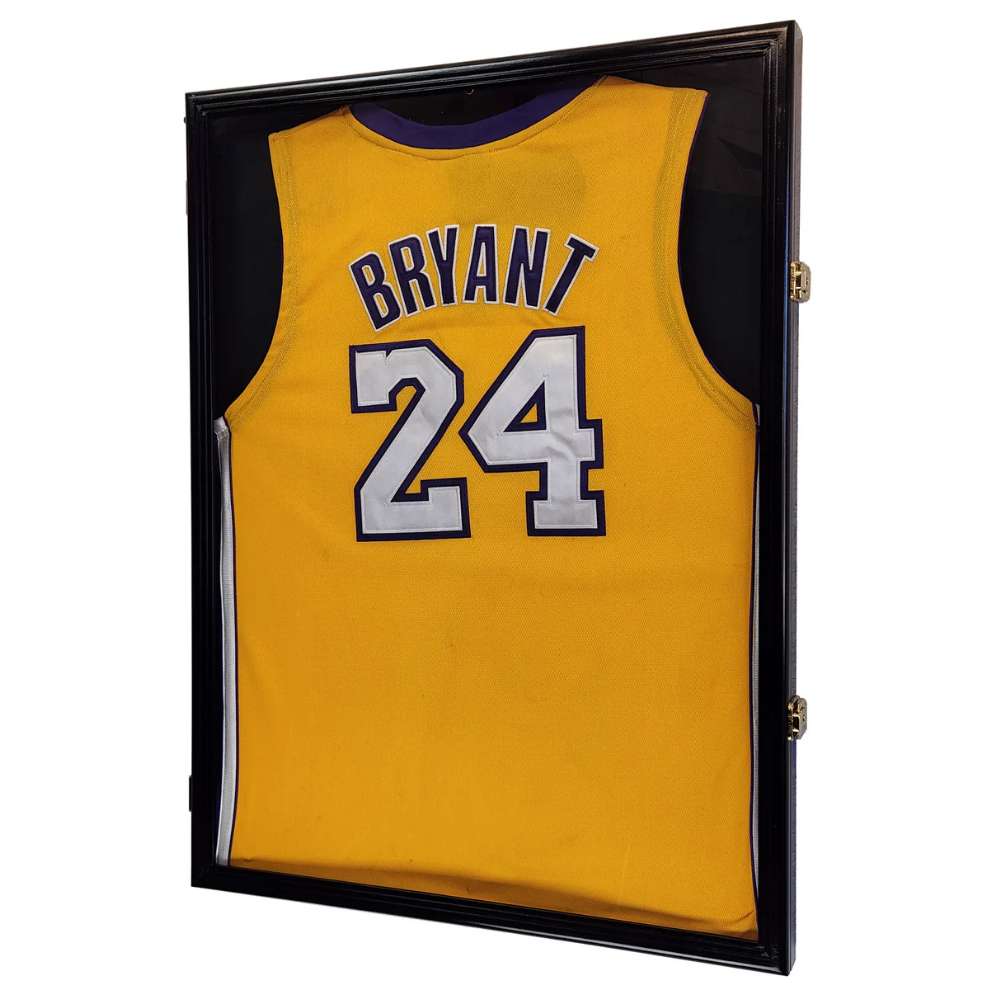 Yellow basketball jersey with 'Bryant' and number '24' in a black display case.