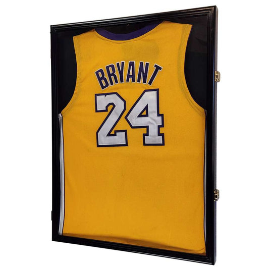 Yellow basketball jersey with 'Bryant' and number '24' in a black display case.